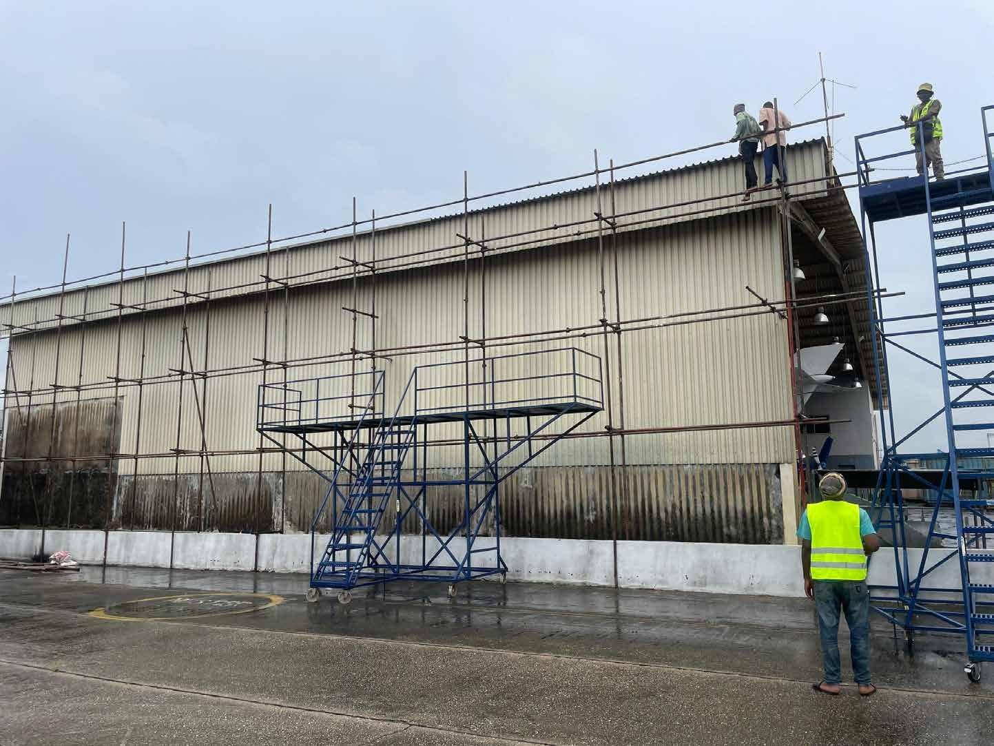 Scaffolding and access stairs against the hangar wall during renovation at MMIA, Ikeja