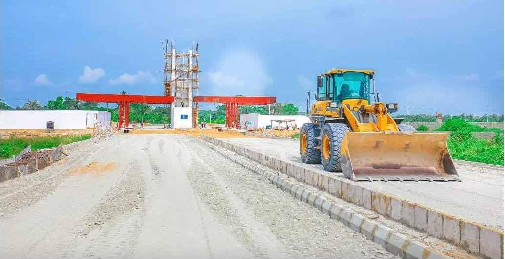 Wheel loader on a prepared road base at ITUNU City, Ibeju-Lekki