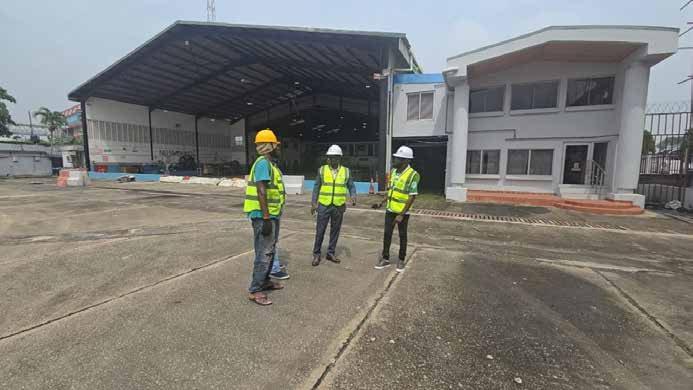 Site team standing in front of the hangar at MMIA, Ikeja